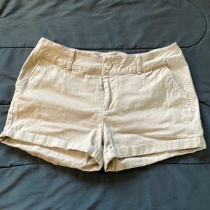 Beige shorts in a medium size.